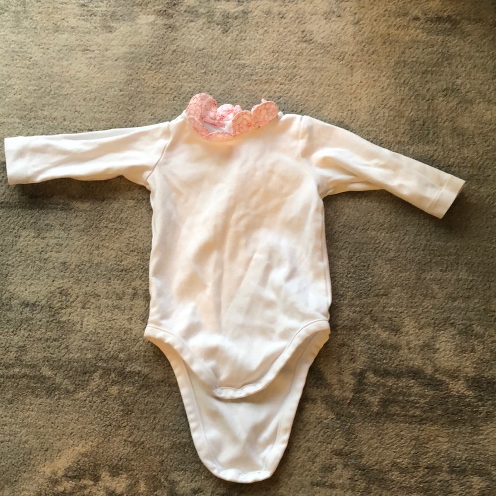 Jacadi white onesie w accented floral collar. Snap closure at bottom.